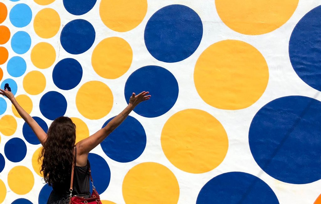 happy-woman-in-front-of-a-wall-with-colorful-circles-colors_@mylove4art